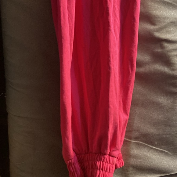 A pink jogger pants with drawstrings. It’s small - Picture 2 of 4